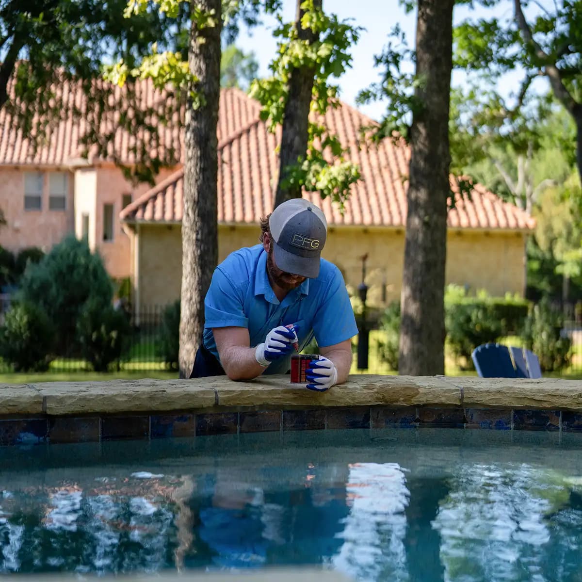 Flower Mound pool technician testing water chemistry using titration method